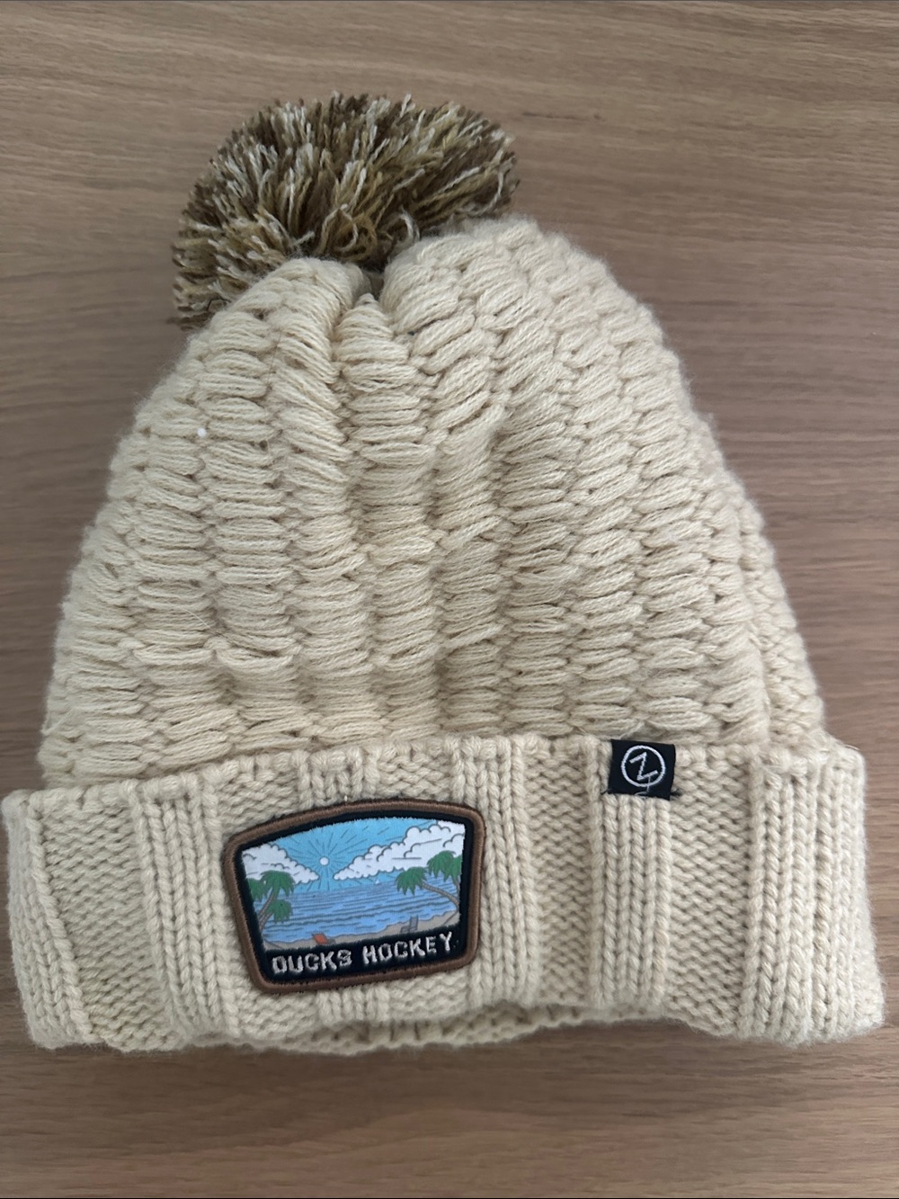 Zephyr Cream Knit Pom Beanie with Ducks Hockey Patch